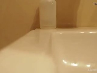 Sexually aroused brunette masturbating in the bathroom