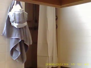 Spying alluring 19 year old lady showering in dorm bathroom