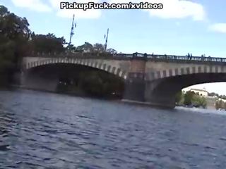 Blonde sucks cock on a boat in full view of the city